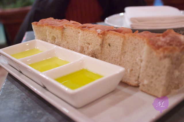 bread with 3 kinds of olive oil Hugh plate of bread plated felt oversize on the tiny table. There were 3 different kinds of olive oil presented. All were very fresh, but I failed to tell the difference. Bread however, while soft and spongy, was cold. :(